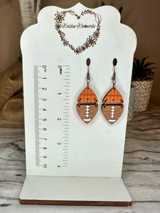Orange football earrings.